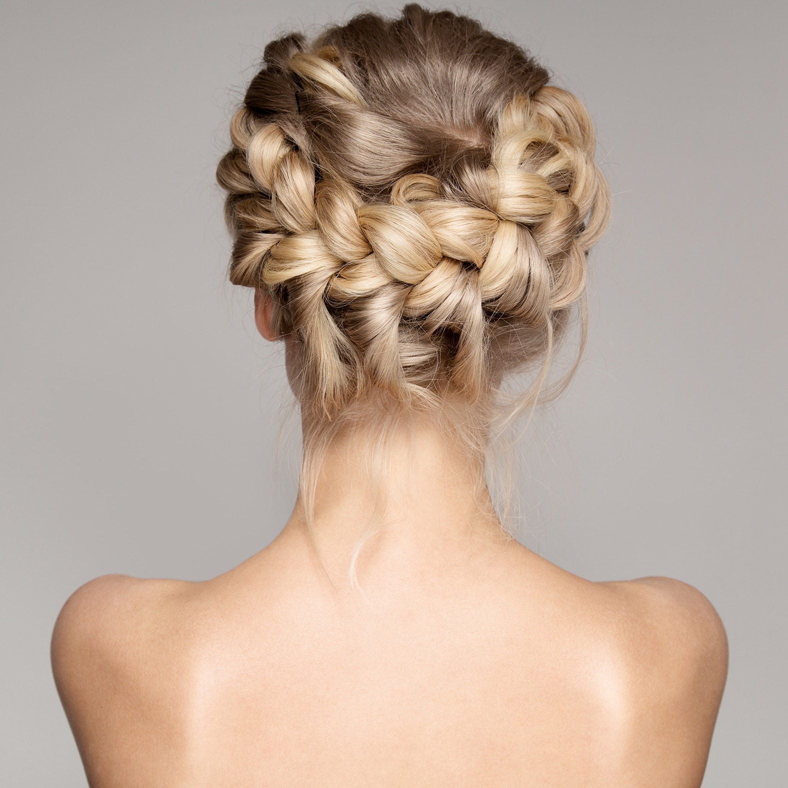 Portrait Of Beautiful Young Blond Woman With Braid Crown Hairstyle.