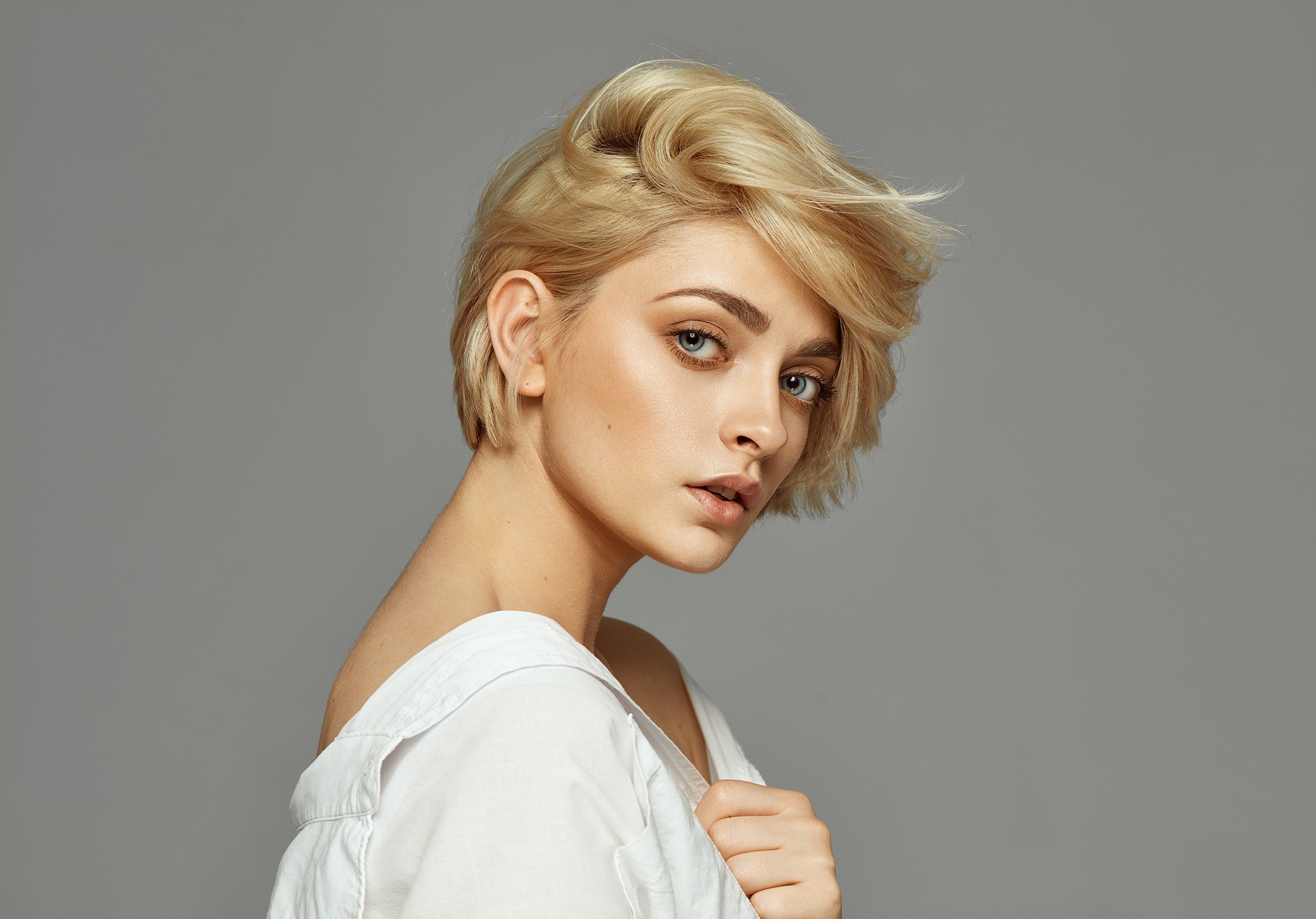 Portrait of young woman with blond short hair